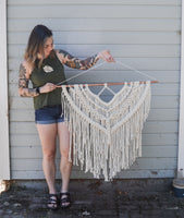 Cheyenne holding macrame wall hanging